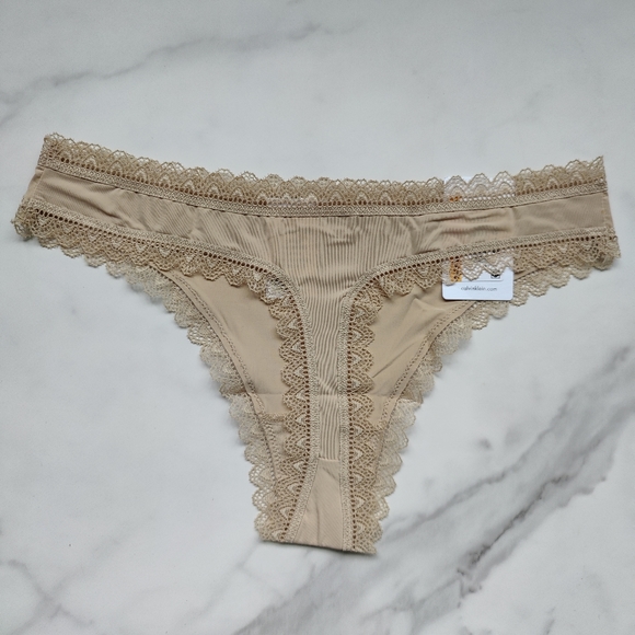 NWT CALVIN KLEIN FLIRTY MICRO THONG PANTY IN DESERT SIZE LARGE - Picture 2 of 5